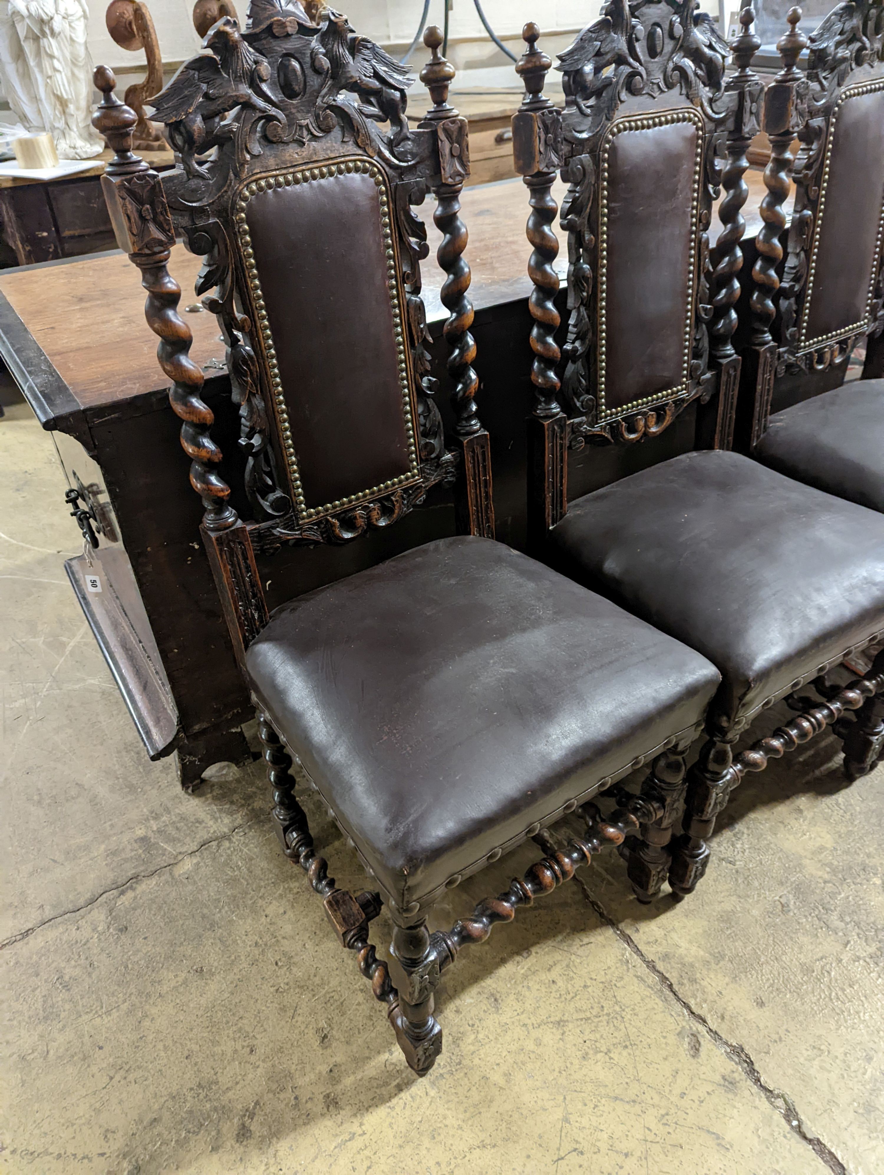 A set of four Flemish style oak Highback dining chairs (1 AF) H-113cm.